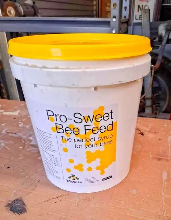 Best Bee Feed: 6 Options for Healthy Honey Bees 6 Bucket of Pro Sweet commercial bee feed syrup designed to provide supplemental nutrition for honey bee colonies.