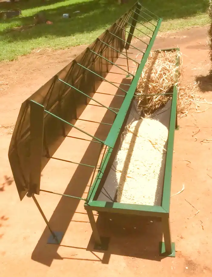 8 Best Goat Feeders: Hay, Grain, Mineral & DIY Options 10 Long metal trough hay feeder with wire rack for goats